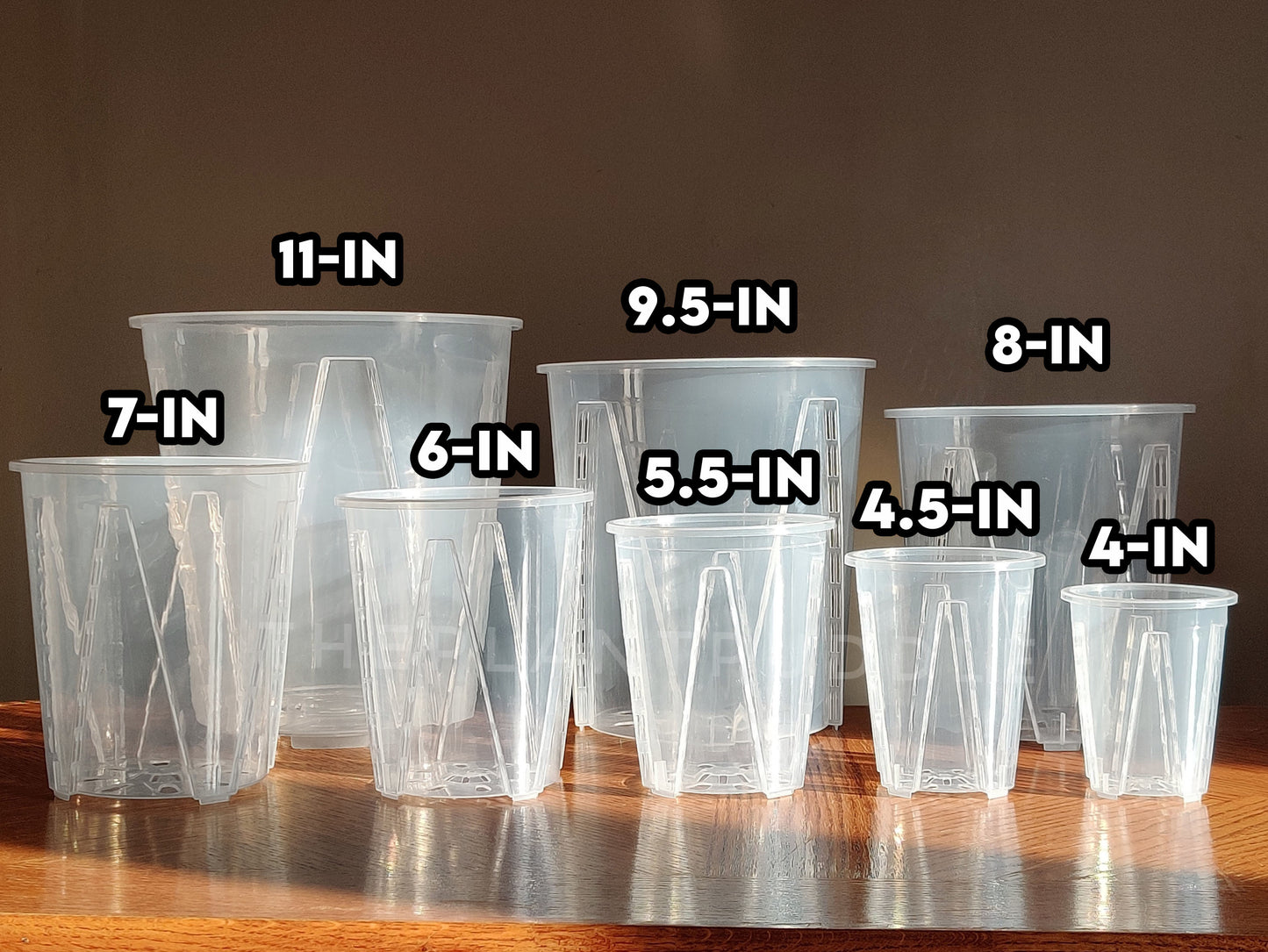 8 sizes of tall clear pots with opening measurement displayed overhead