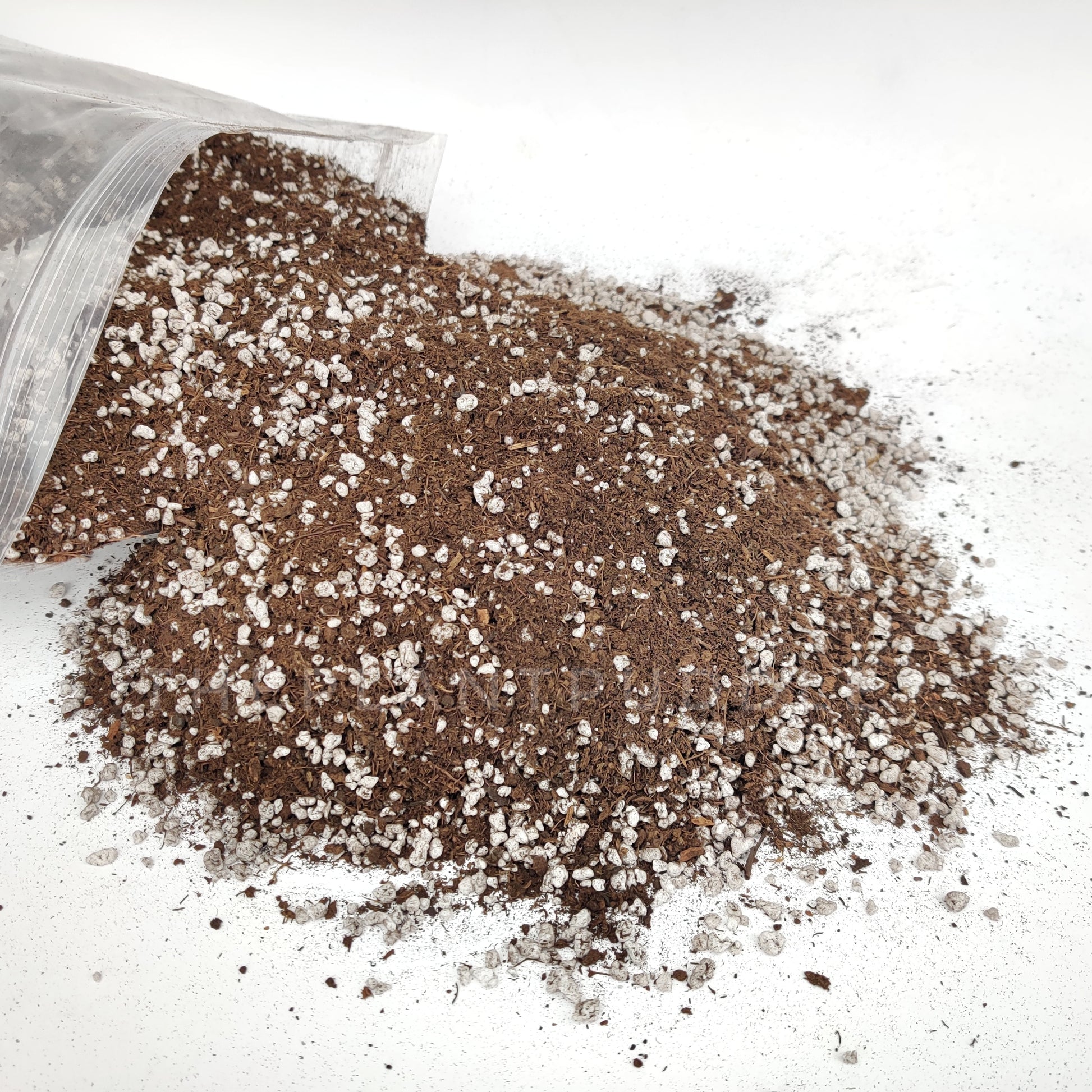 blend of peat and perlite spilling out of bag