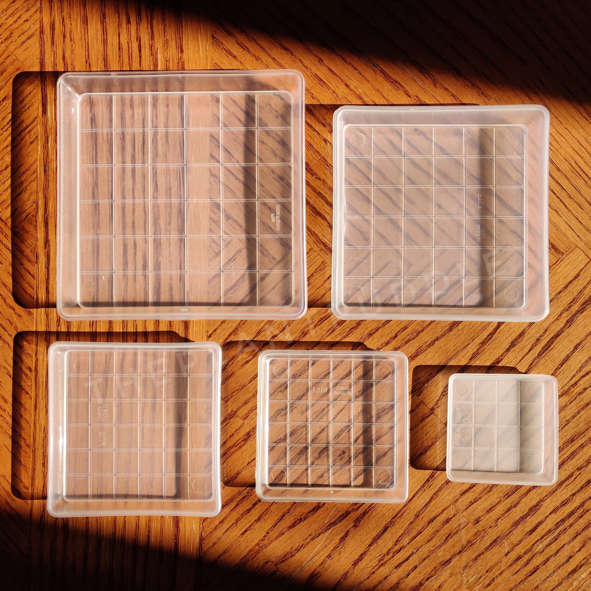 square plant pot saucers shown in 5 sizes