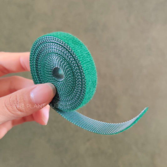 small roll of green plant hook and loop tape tie