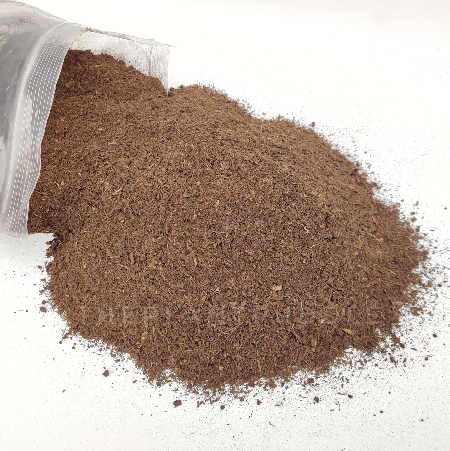 fine peat moss spilled from bag